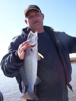 Dennis poses with his first speckled trout